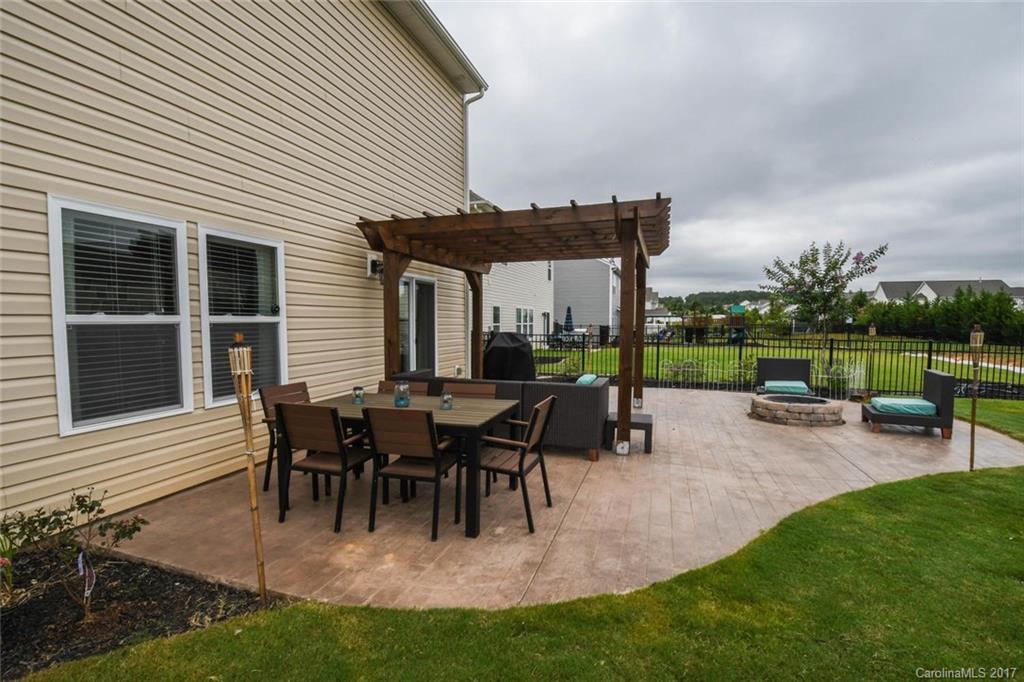 79457 Ridgehaven Road Lancaster, SC 29720 - Photo 23 of 24 a view of a house and chair and table in the garden