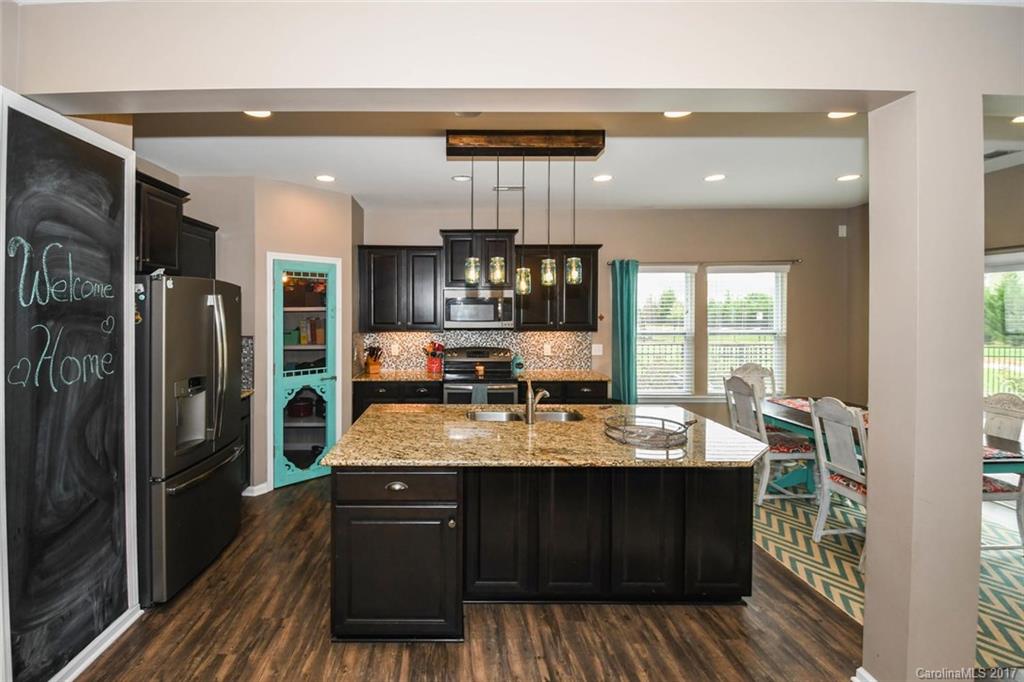 79457 Ridgehaven Road Lancaster, SC 29720 - Photo 8 of 24 a large kitchen with a counter space a sink and stainless steel appliances