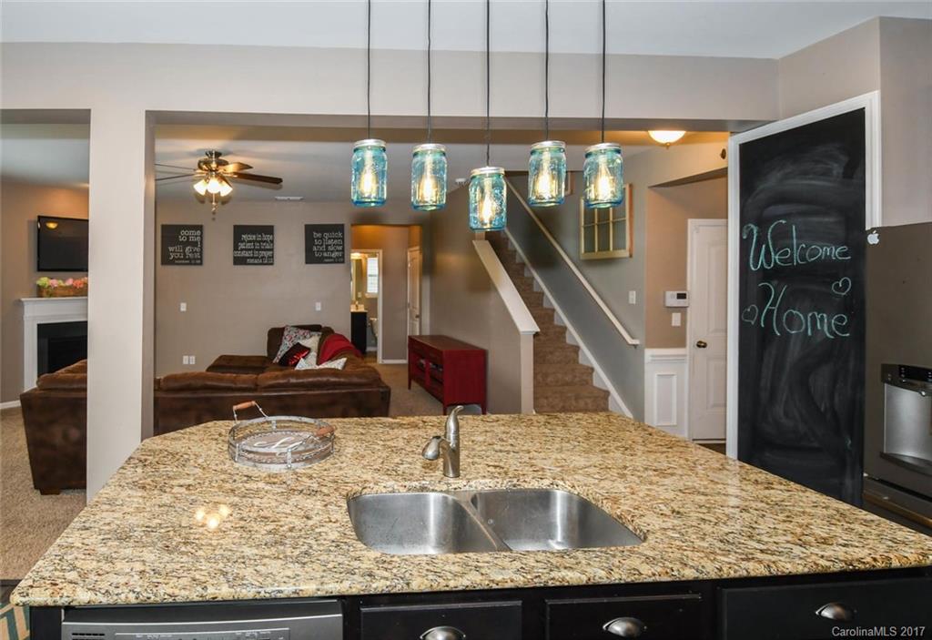 79457 Ridgehaven Road Lancaster, SC 29720 - Photo 9 of 24 a kitchen with granite countertop a sink and a refrigerator