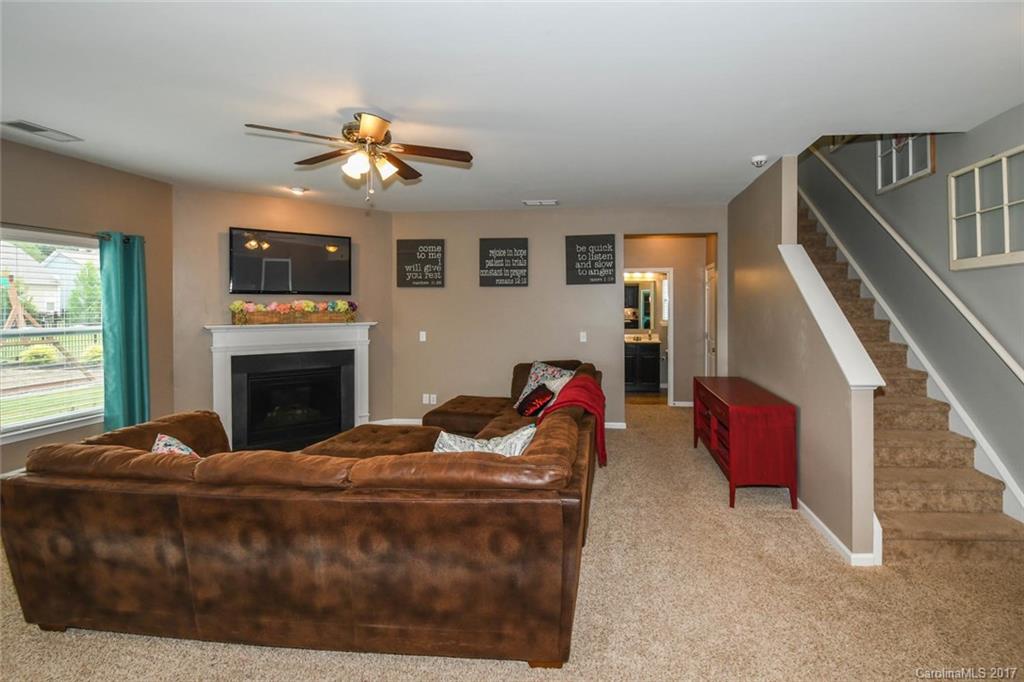 79457 Ridgehaven Road Lancaster, SC 29720 - Photo 10 of 24 a living room with furniture fireplace and flat screen tv