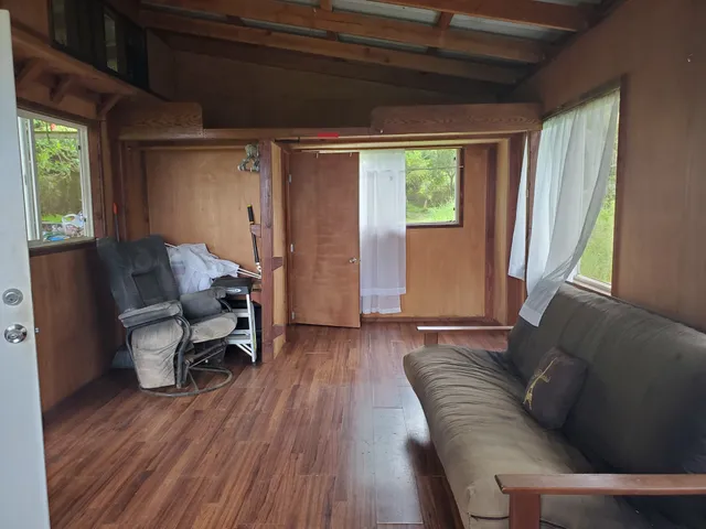 a view of a two chairs in the balcony