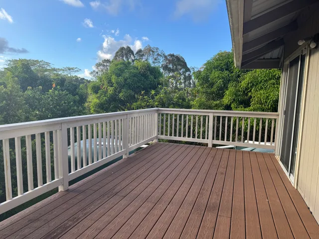 a view of a balcony with a pot