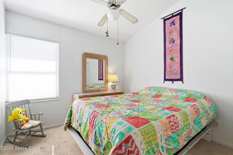 a bedroom that has a bed and a window