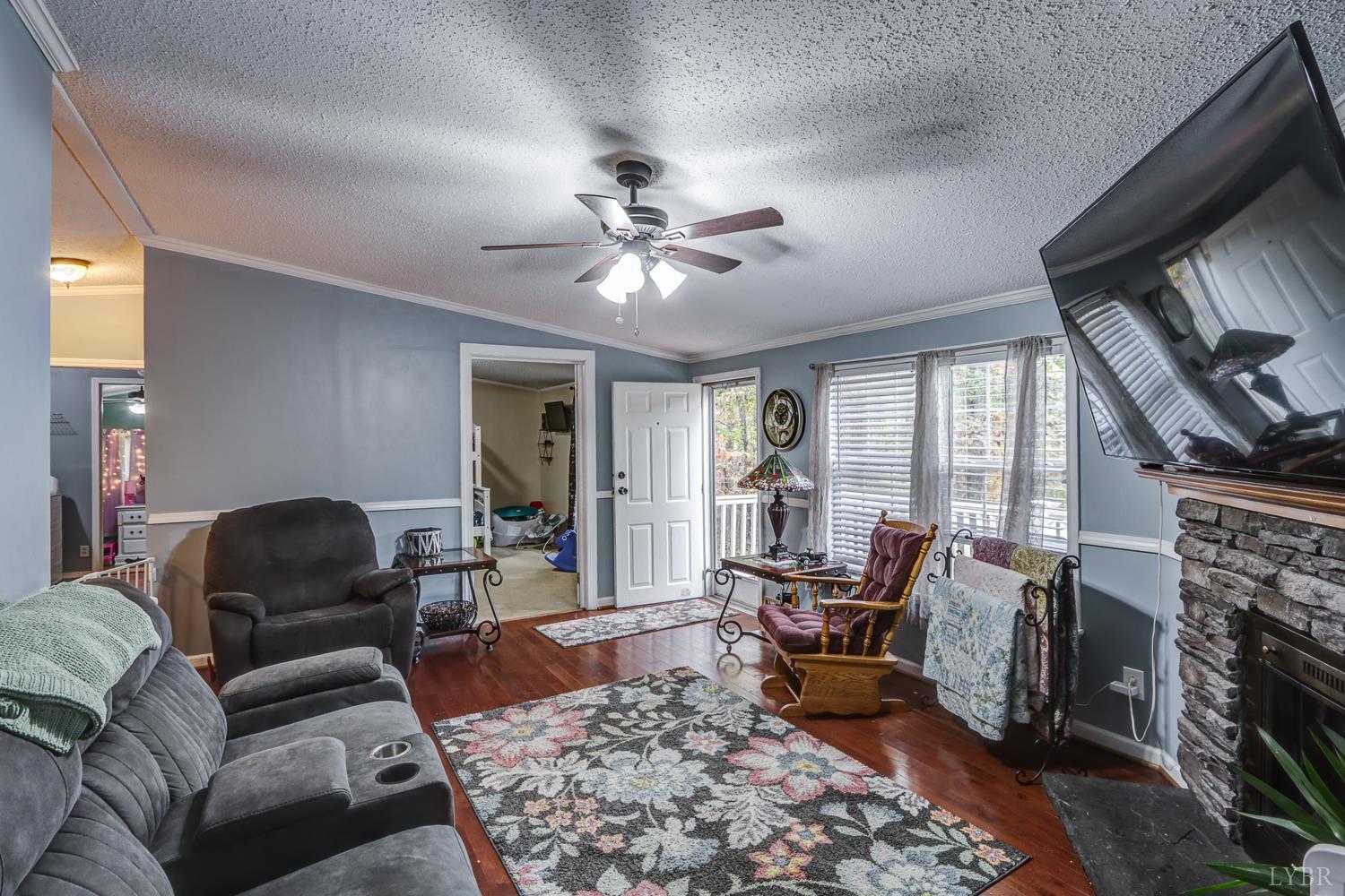 2019 Country Club Road Hurt, VA 24563 - Photo 13 of 39 a living room with furniture and a fireplace