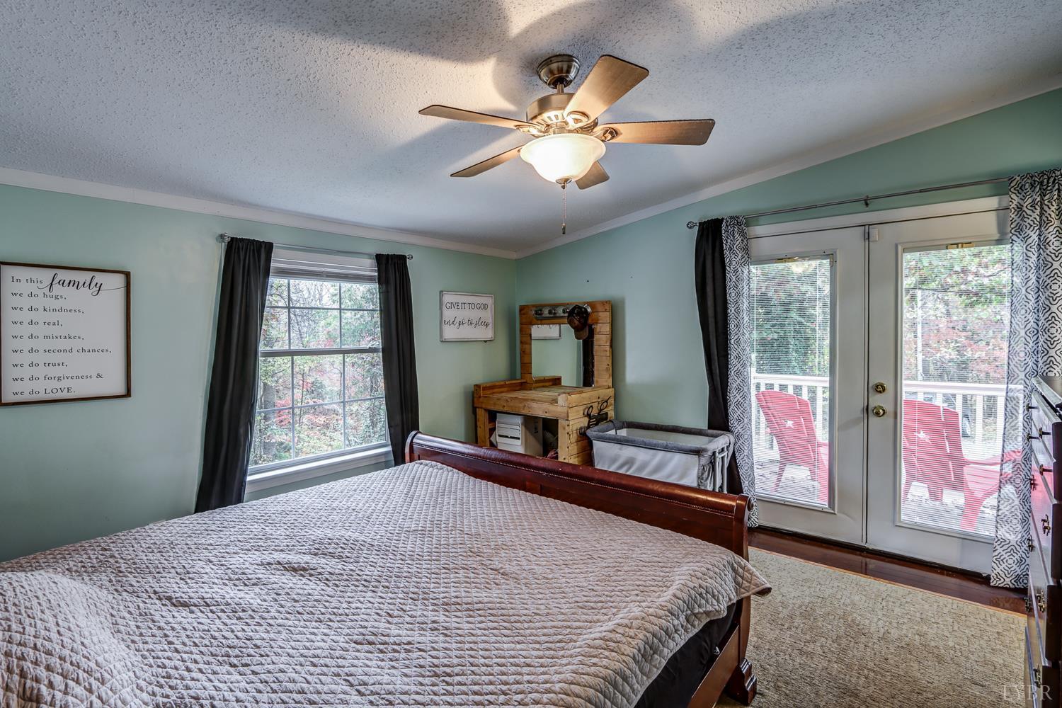 2019 Country Club Road Hurt, VA 24563 - Photo 16 of 39 a bedroom with a large bed and a large window