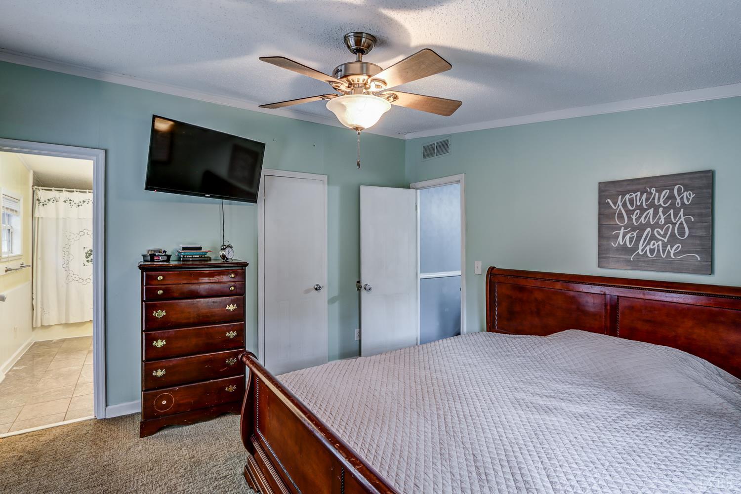 2019 Country Club Road Hurt, VA 24563 - Photo 17 of 39 a bedroom with a bed and a flat screen tv