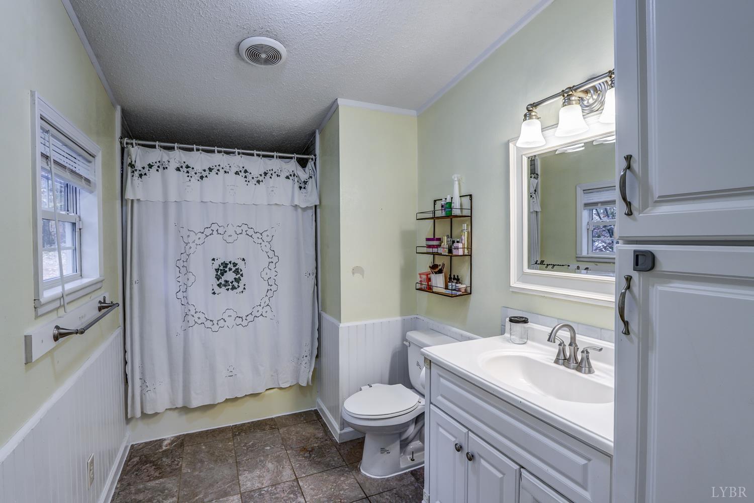 2019 Country Club Road Hurt, VA 24563 - Photo 20 of 39 a bathroom with a sink toilet and shower