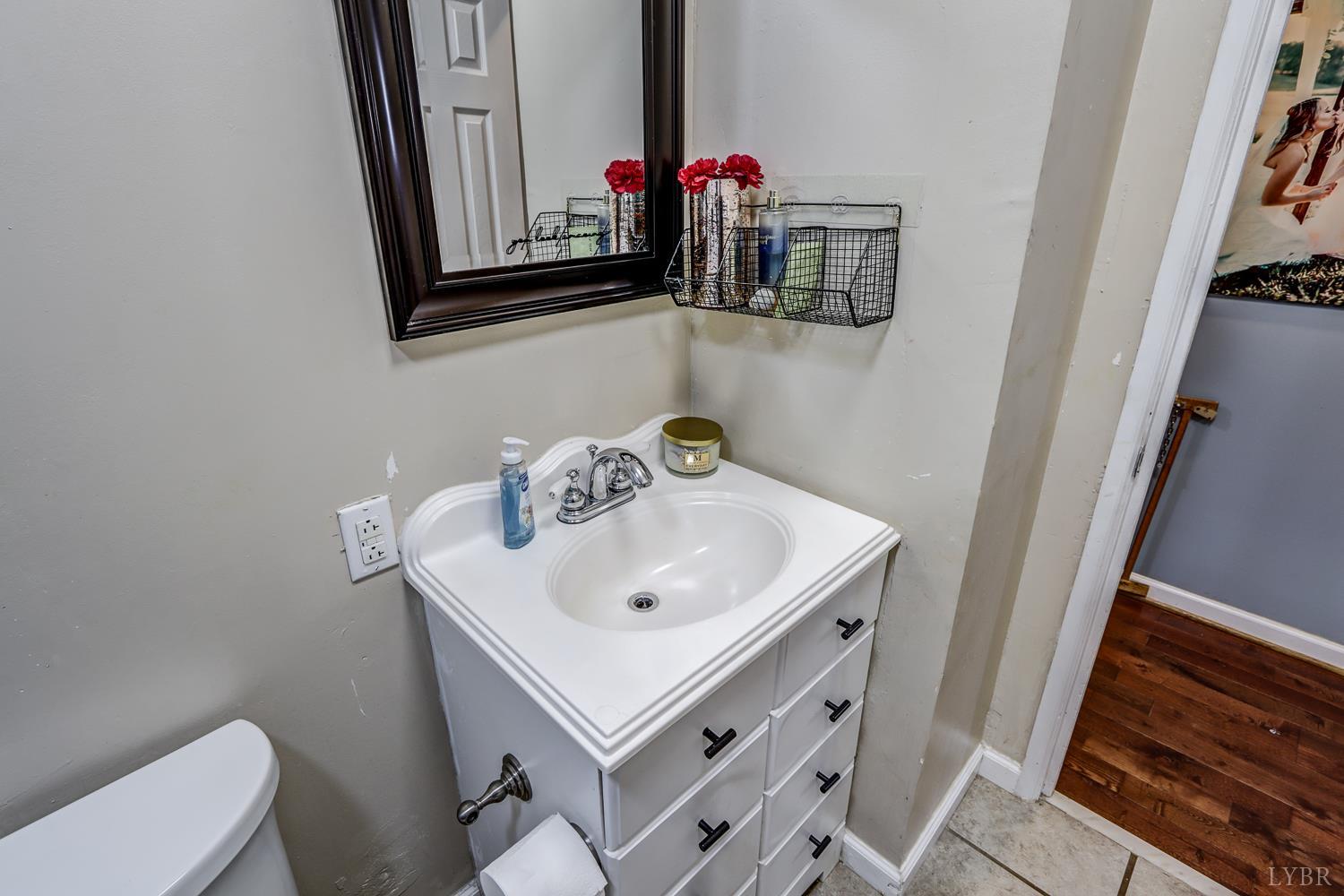 2019 Country Club Road Hurt, VA 24563 - Photo 23 of 39 a bathroom with a sink and a mirror