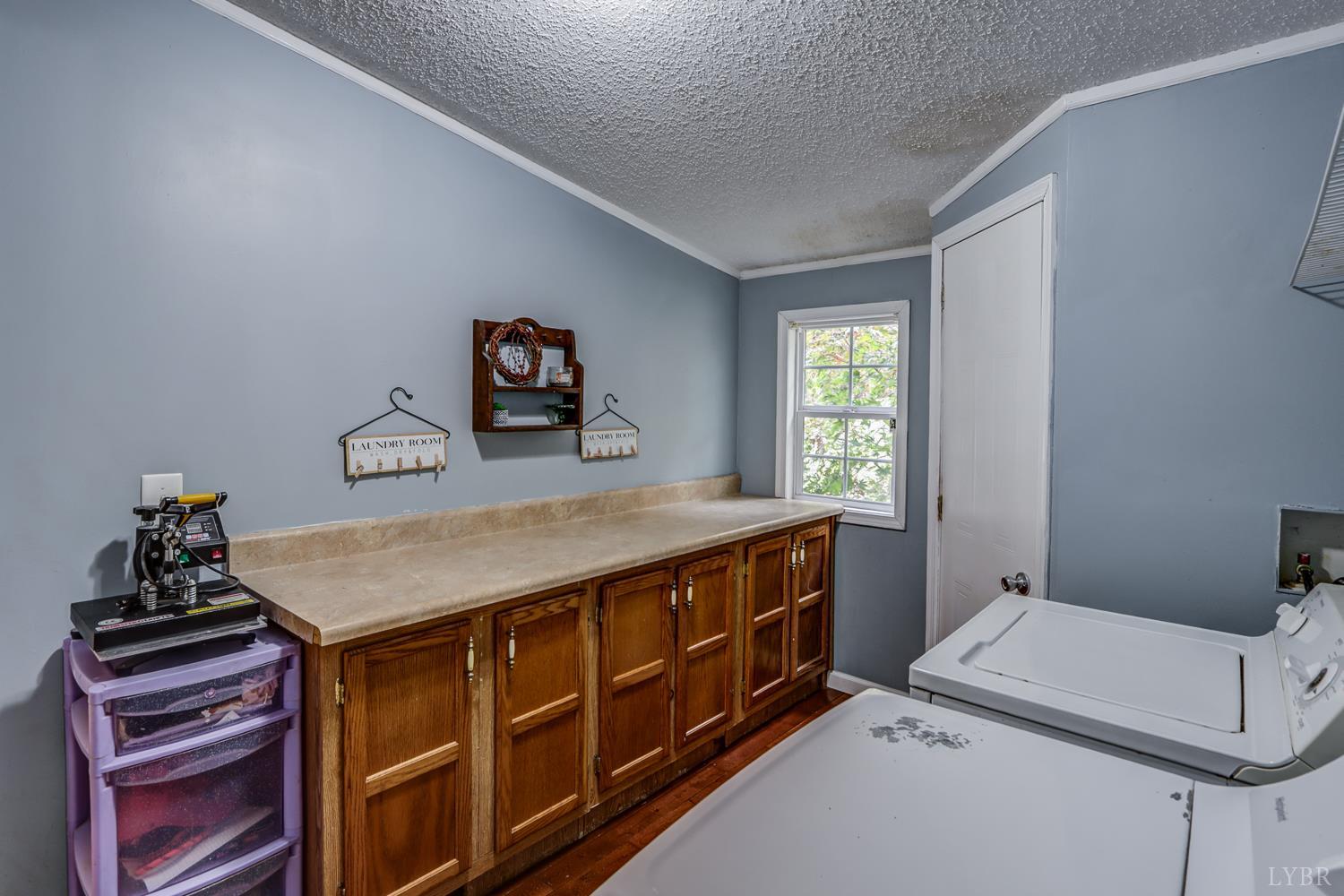 2019 Country Club Road Hurt, VA 24563 - Photo 29 of 39 a room with a bed and a chandelier