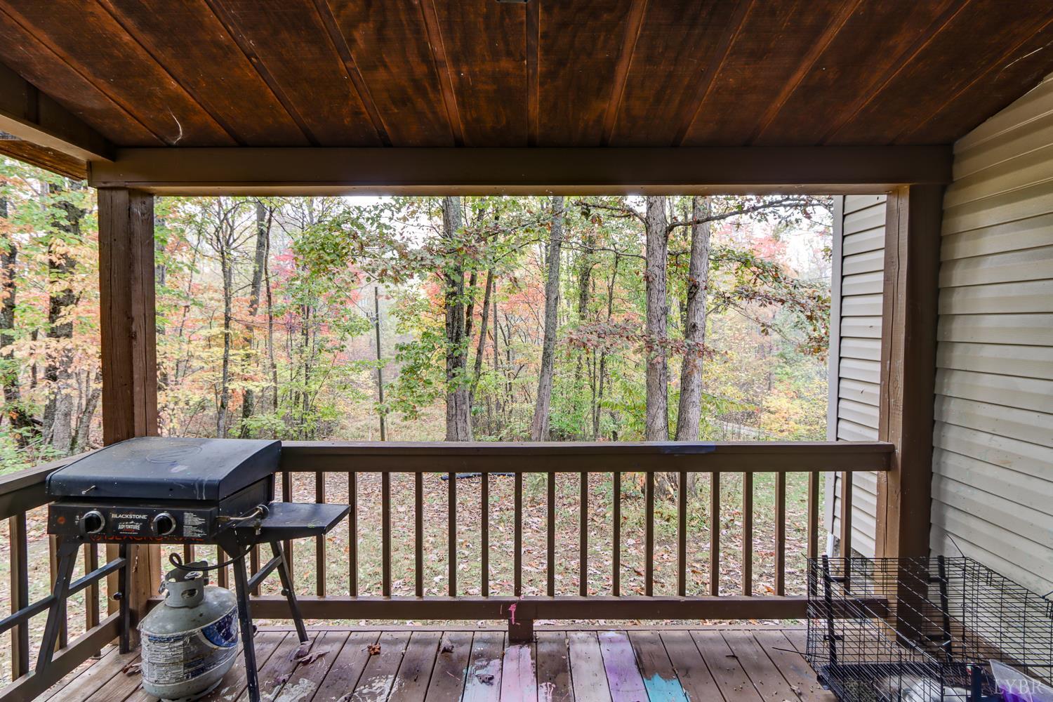 2019 Country Club Road Hurt, VA 24563 - Photo 39 of 39 a view of a porch with furniture and wooden floor