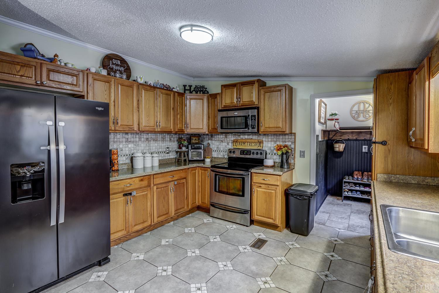 2019 Country Club Road Hurt, VA 24563 - Photo 5 of 39 a kitchen with stainless steel appliances granite countertop a refrigerator and a stove top oven