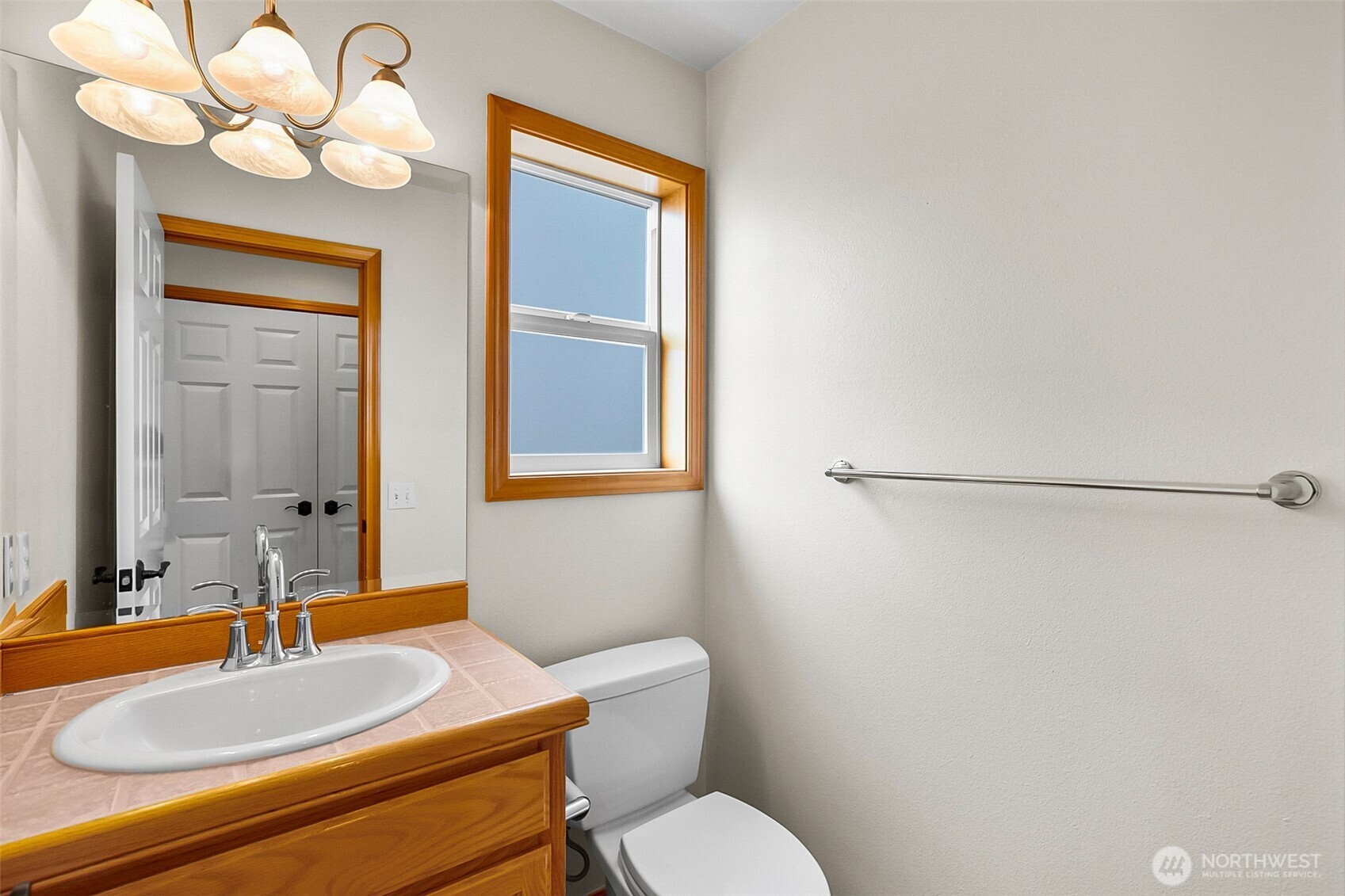 18410 11th Drive Southeast Bothell, WA 98012 - Photo 19 of 40 a bathroom with a sink a toilet and mirror