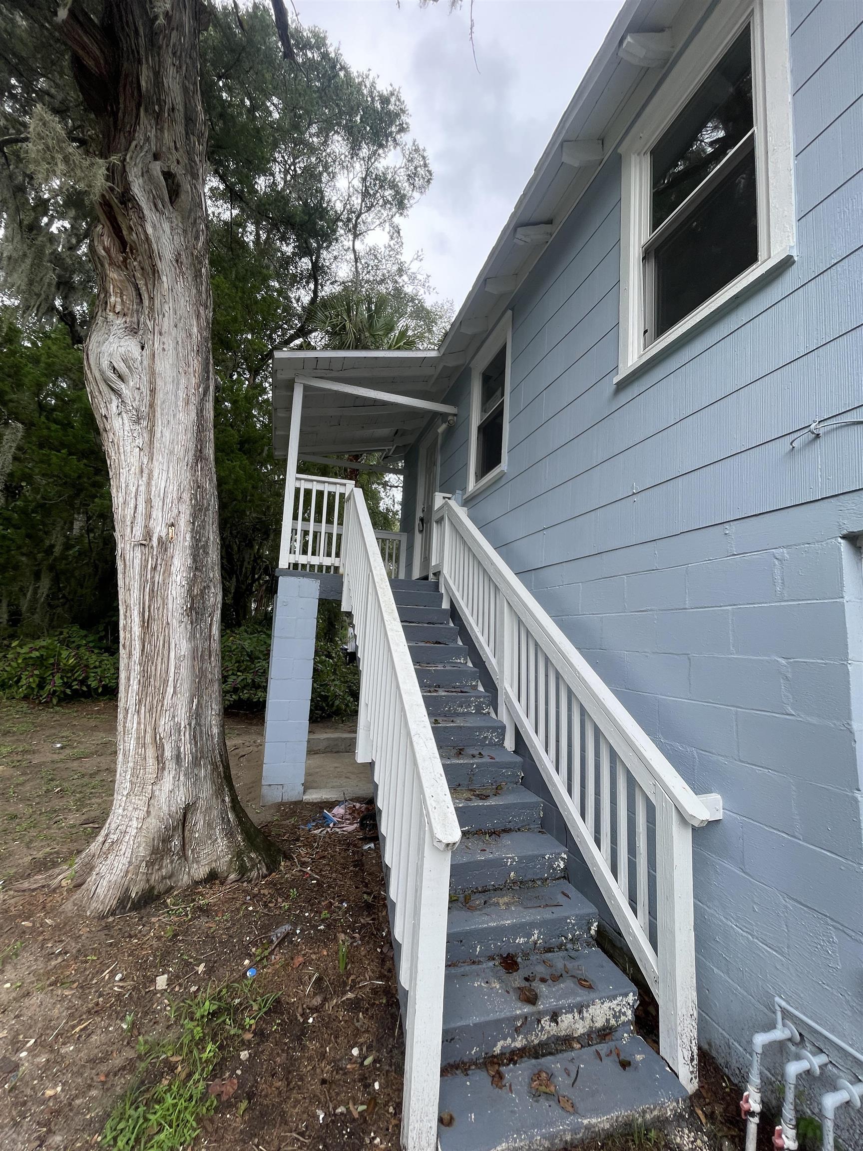560 Christopher Street, Unit A St. Augustine, FL 32084 - Photo 2 of 8 Deck featuring stairs