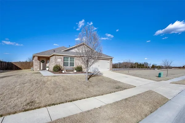 a front view of a house with yard