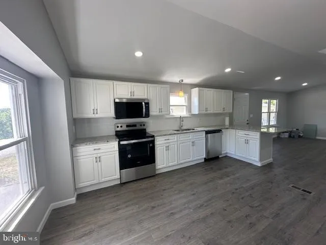 wooden floor and window in an empty room