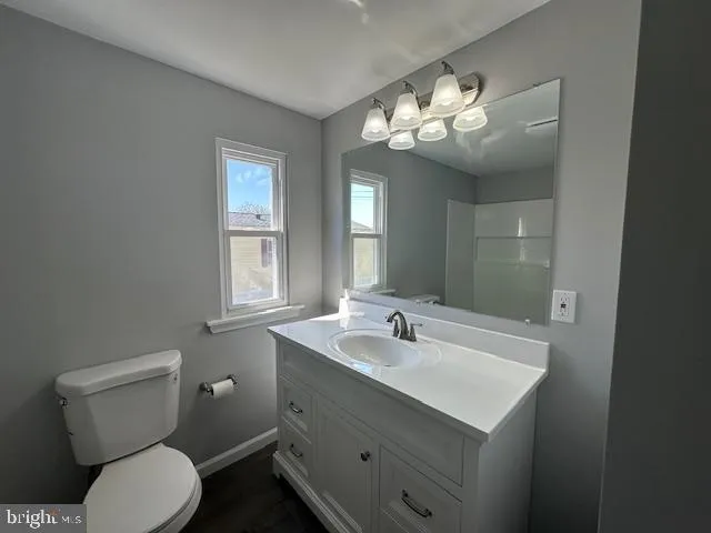 a bathroom with a toilet a sink and bathtub