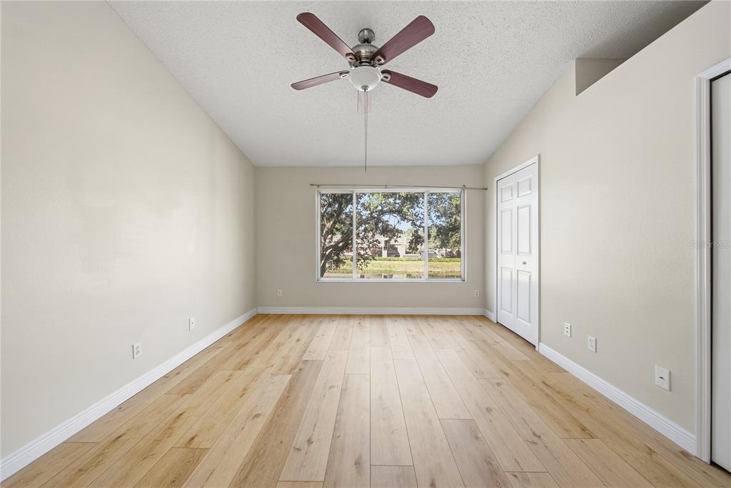 8530 Hunters Key Circle Tampa, FL 33647 - Photo 15 of 18 wooden floor in an empty room with a window