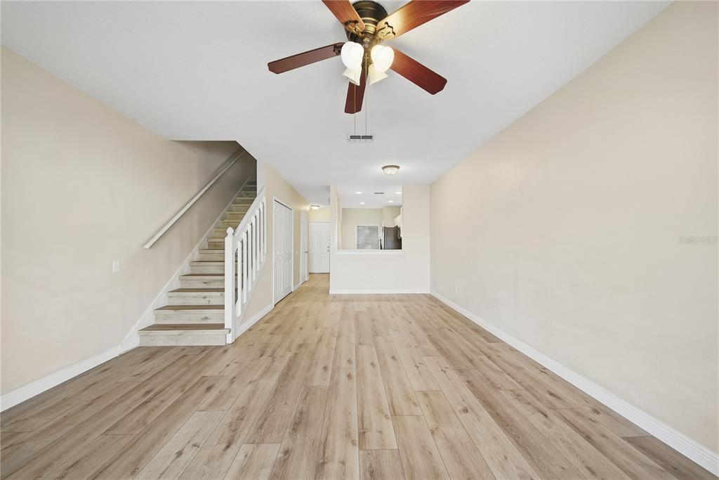 8530 Hunters Key Circle Tampa, FL 33647 - Photo 8 of 18 wooden floor in an empty room with a window