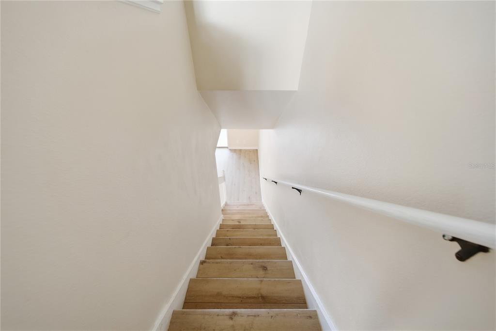 8530 Hunters Key Circle Tampa, FL 33647 - Photo 10 of 18 a view of a hallway with wooden floor