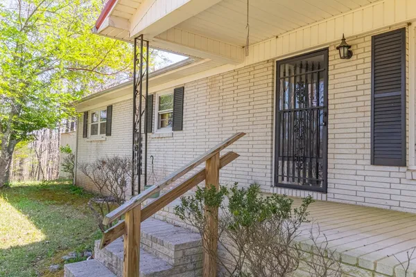 a view of a backyard of the house