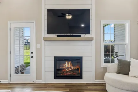 a living room with furniture and a fireplace