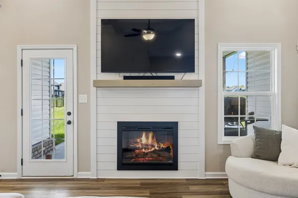 a living room with furniture and a fireplace
