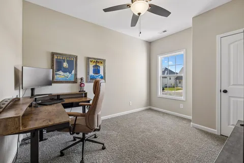 a view of a workspace with furniture