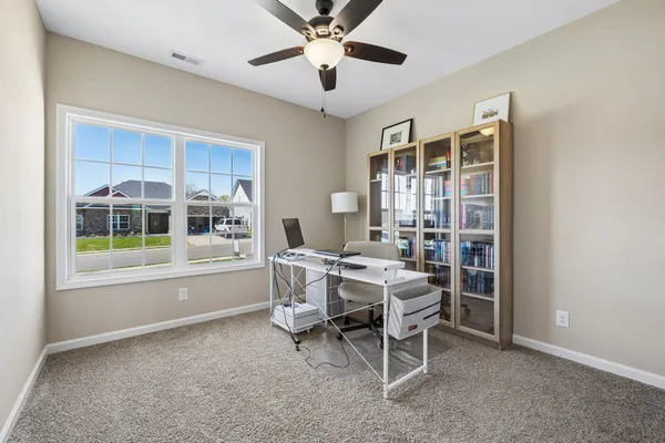 a dining room with furniture and window