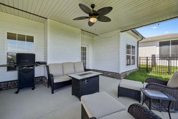 a balcony with furniture and a garden
