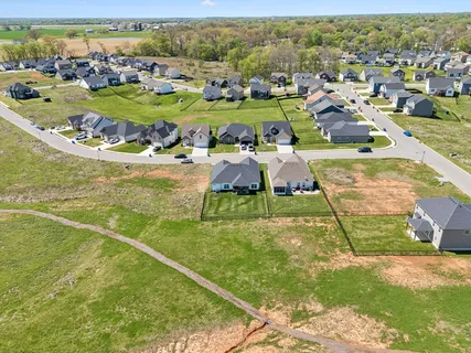 an aerial view of a residential houses with outdoor space
