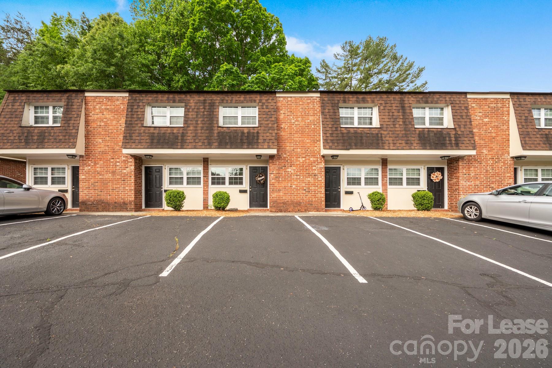 135 Ribet Avenue Southwest, Unit C12 Valdese, NC 28690 - Photo 2 of 19 a view of a building with a street