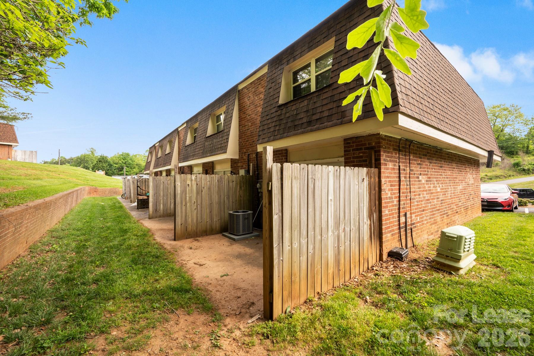 135 Ribet Avenue Southwest, Unit C12 Valdese, NC 28690 - Photo 3 of 19 a front view of a house with a yard