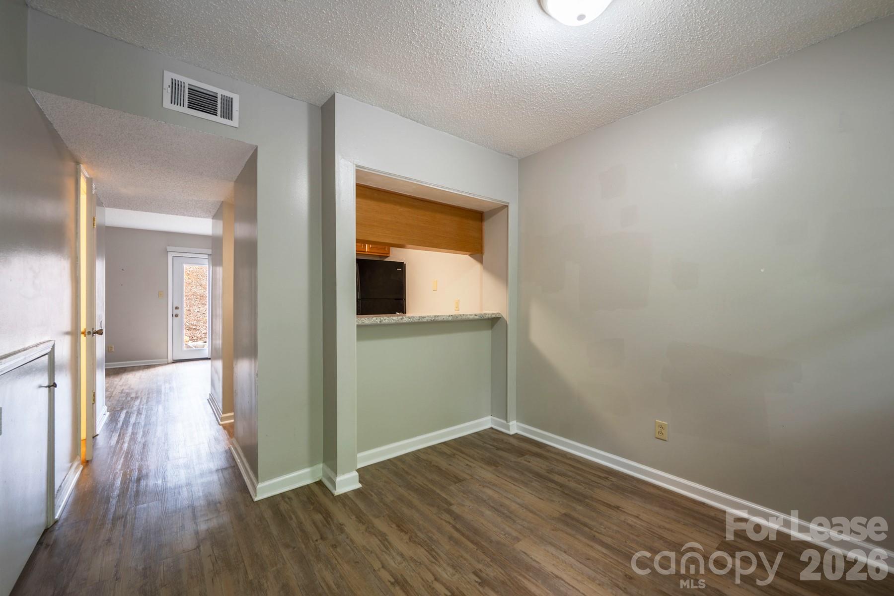 135 Ribet Avenue Southwest, Unit C12 Valdese, NC 28690 - Photo 5 of 19 wooden floor in an empty room