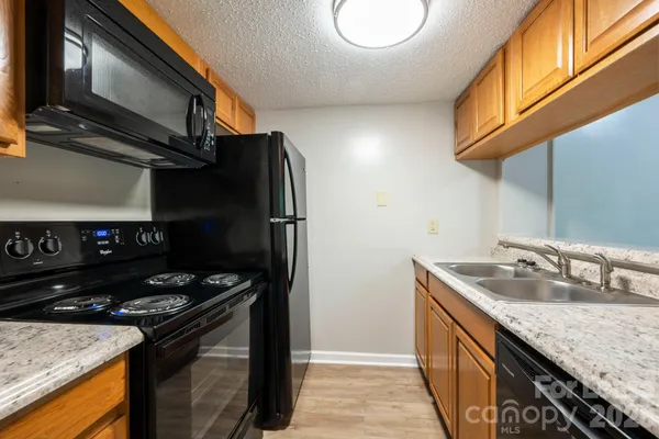 a kitchen with a stove and a microwave