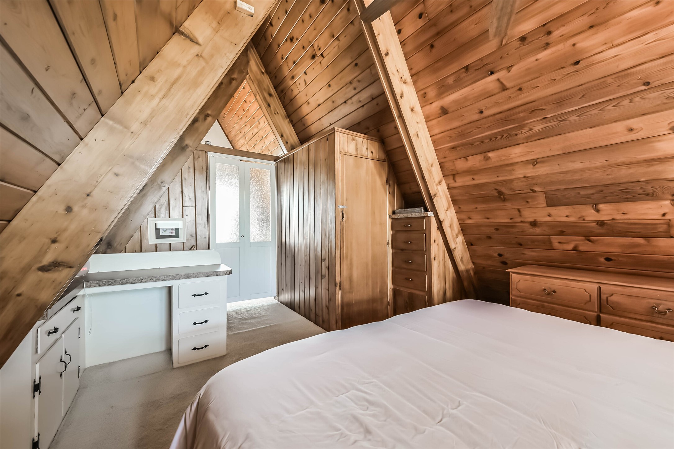 2009 Todville Road Seabrook, TX 77586 - Photo 23 of 46 a bedroom with a bed and a chandelier