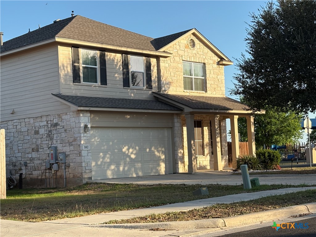 102 Wisteria Way San Marcos, TX 78666 - Photo 1 of 30 a front view of a house with a yard