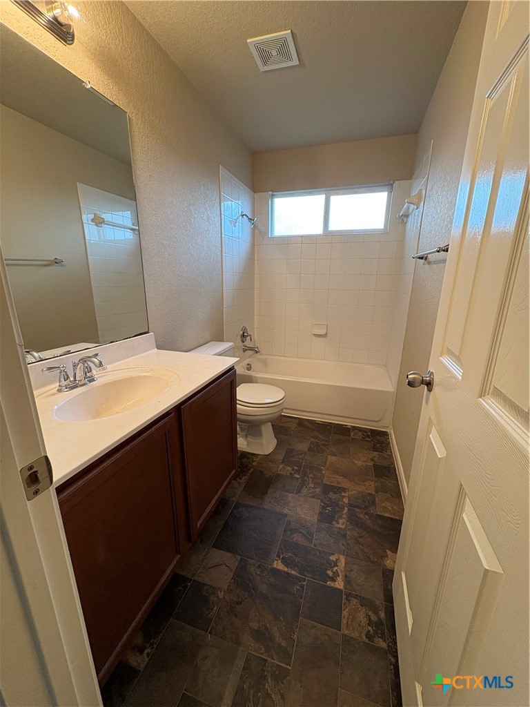 102 Wisteria Way San Marcos, TX 78666 - Photo 30 of 30 a bathroom with a sink a toilet and shower