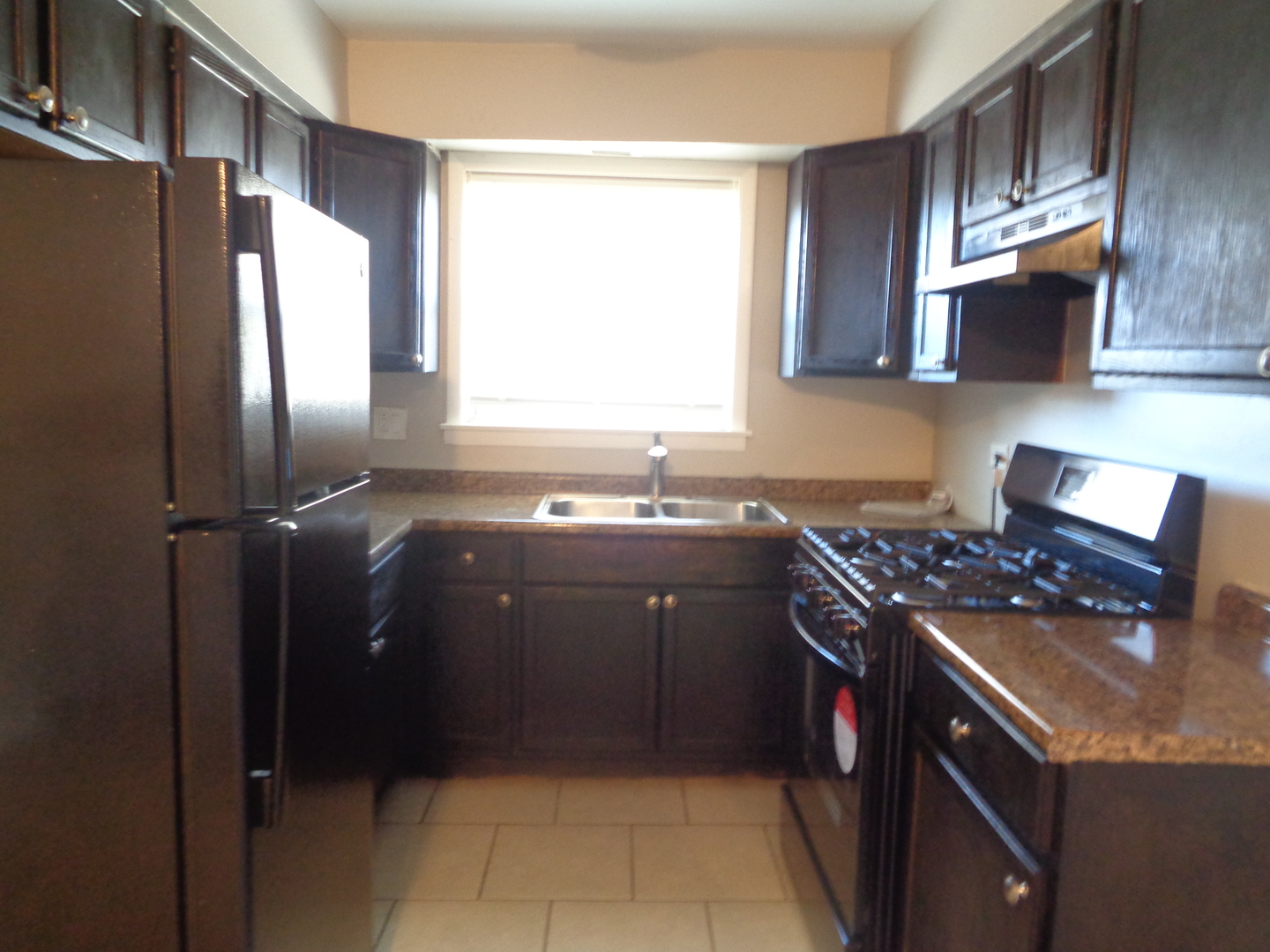 8149 83rd Place, Unit 2 Justice, IL 60458 - Photo 5 of 10 a kitchen with a sink stove and refrigerator