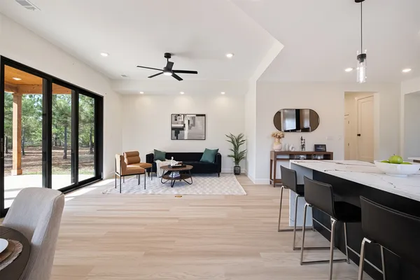 a kitchen with a table and chairs in it
