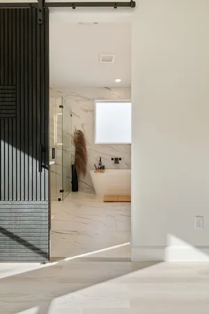 a bedroom with a bed and a table