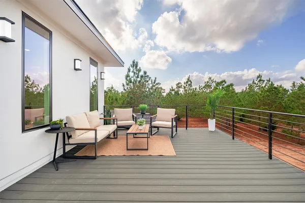 a view of a patio with a table and chairs