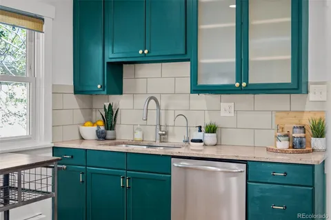 a kitchen with a sink and cabinets