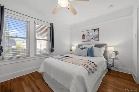 a bedroom with bed and a window