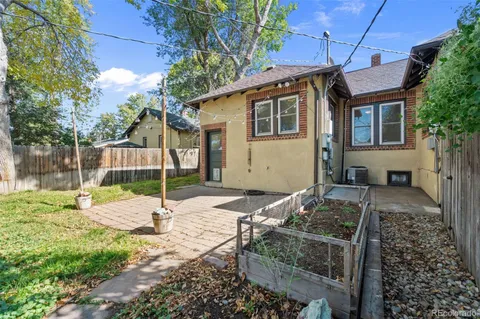 a backyard of a house with seating space