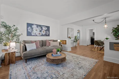 a living room with furniture and a table