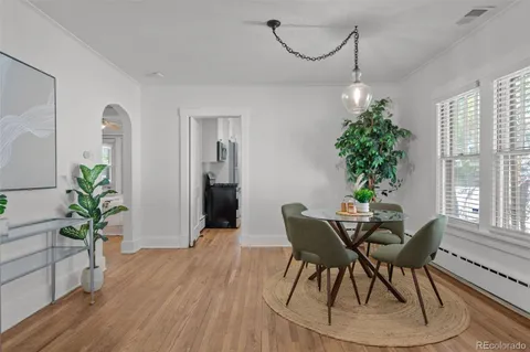 a view of a dining room with furniture window and wooden floor