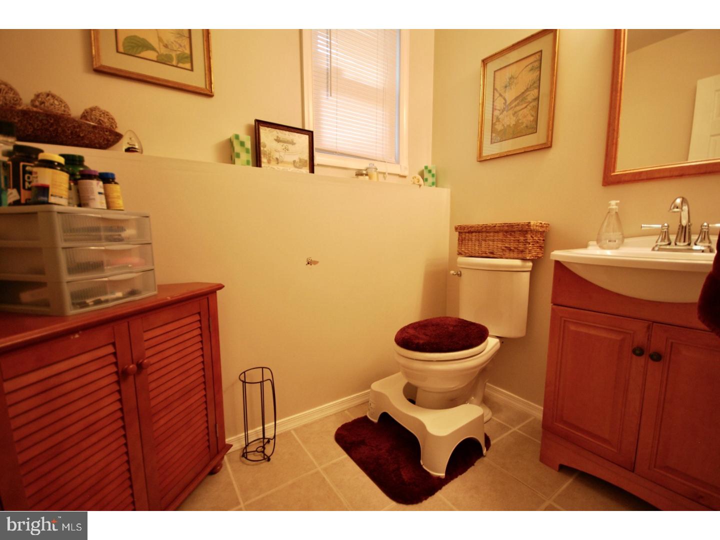 23 Orion Way Sewell, NJ 08080 - Photo 19 of 25 a bathroom with a sink and a toilet