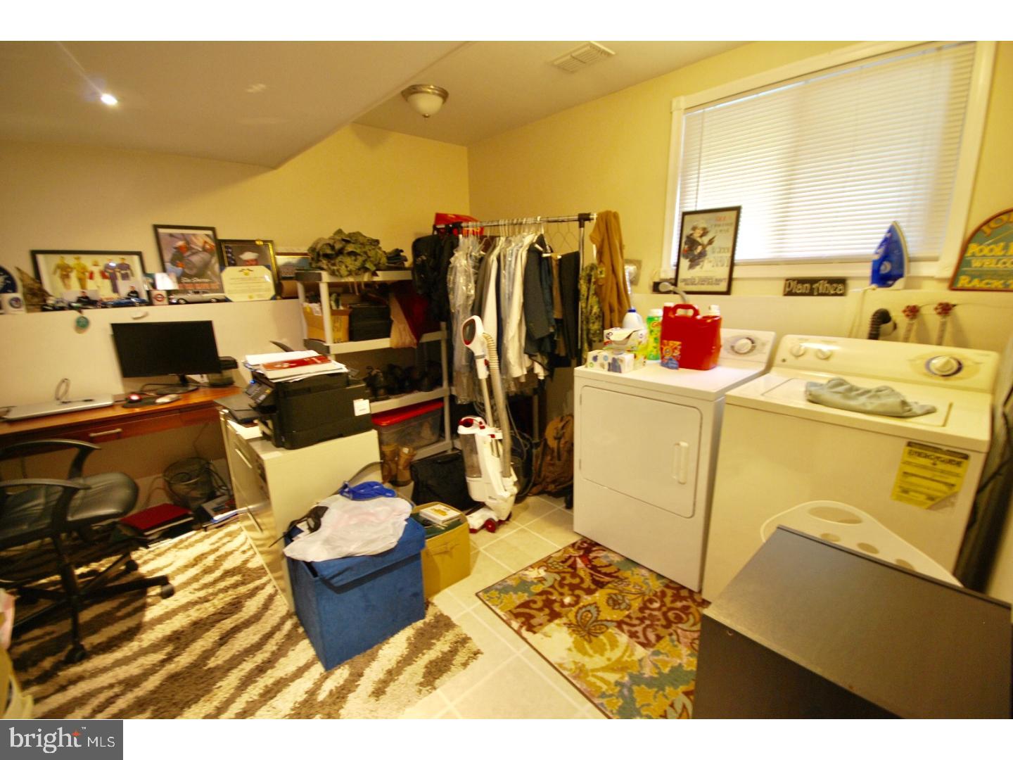 23 Orion Way Sewell, NJ 08080 - Photo 20 of 25 a bed room with a bed and a television