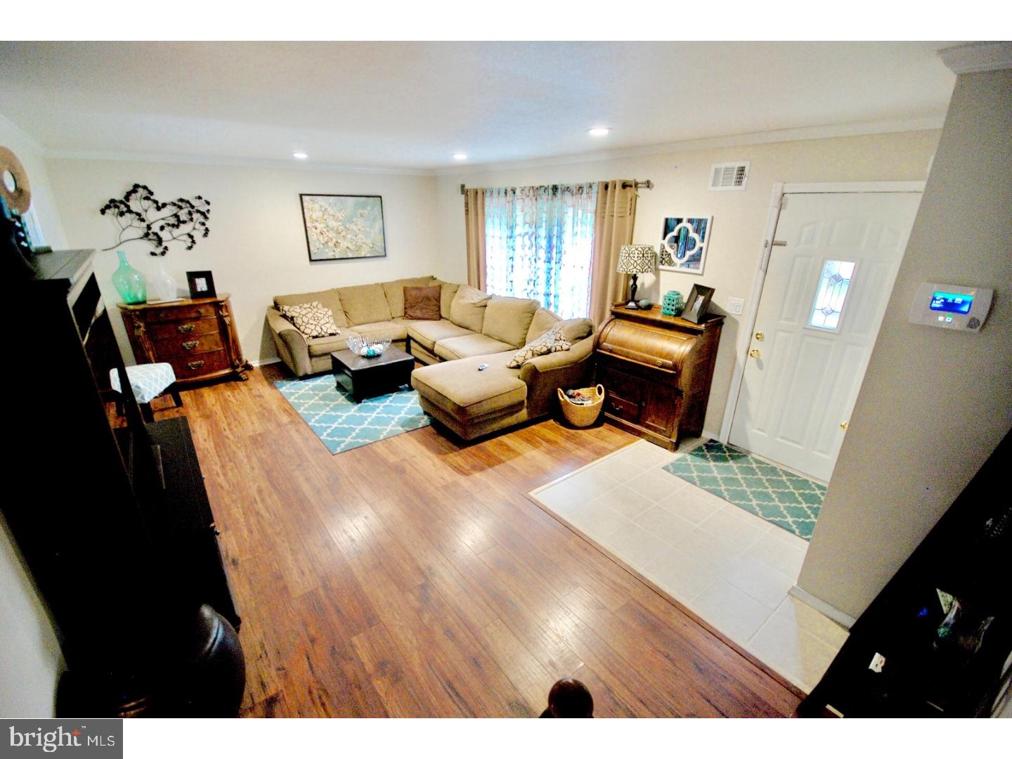 23 Orion Way Sewell, NJ 08080 - Photo 4 of 25 a living room with furniture and a wooden floor