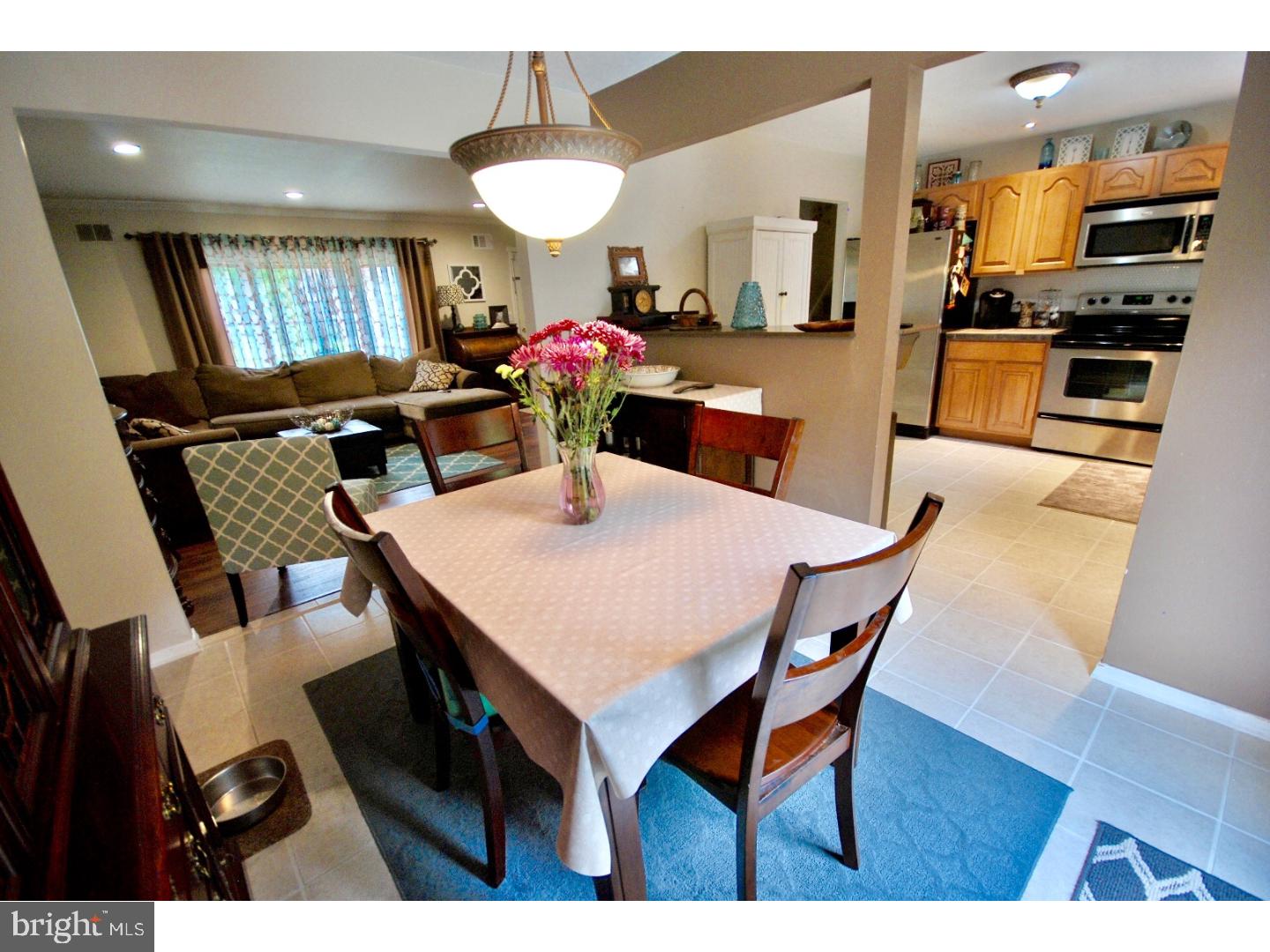 23 Orion Way Sewell, NJ 08080 - Photo 5 of 25 a view of a dining room with furniture and a potted plant